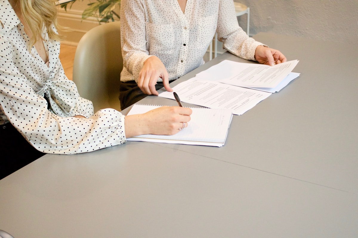 Two professionals reviewing and signing a Data Processing Agreement — DPDP Act India 2026